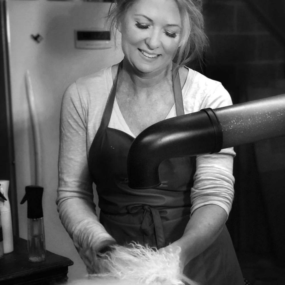 Allison Foley using the Best Dog Grooming Brush