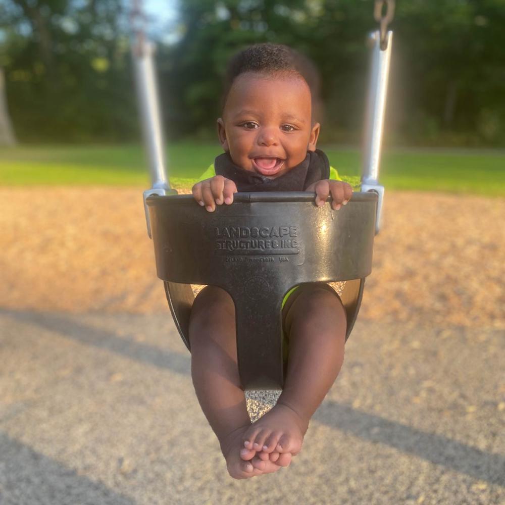 Anansi swinging at the park