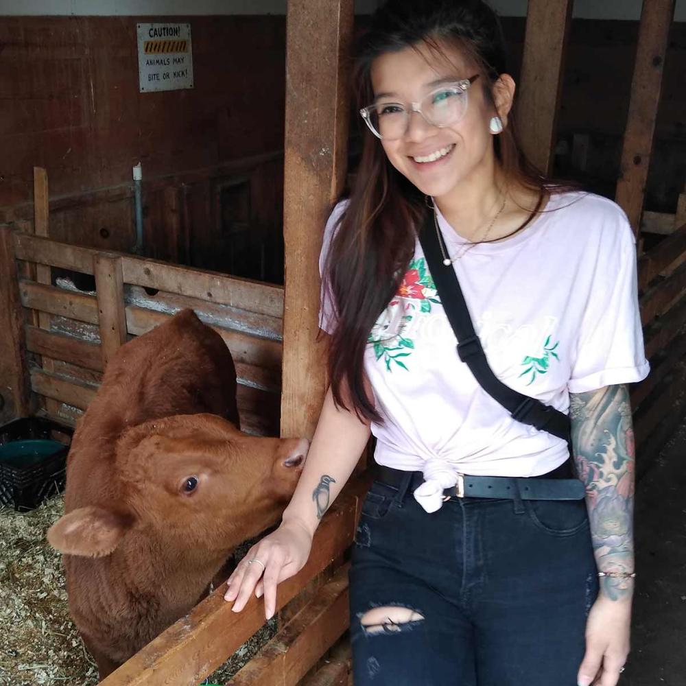 Magdalena and a cow