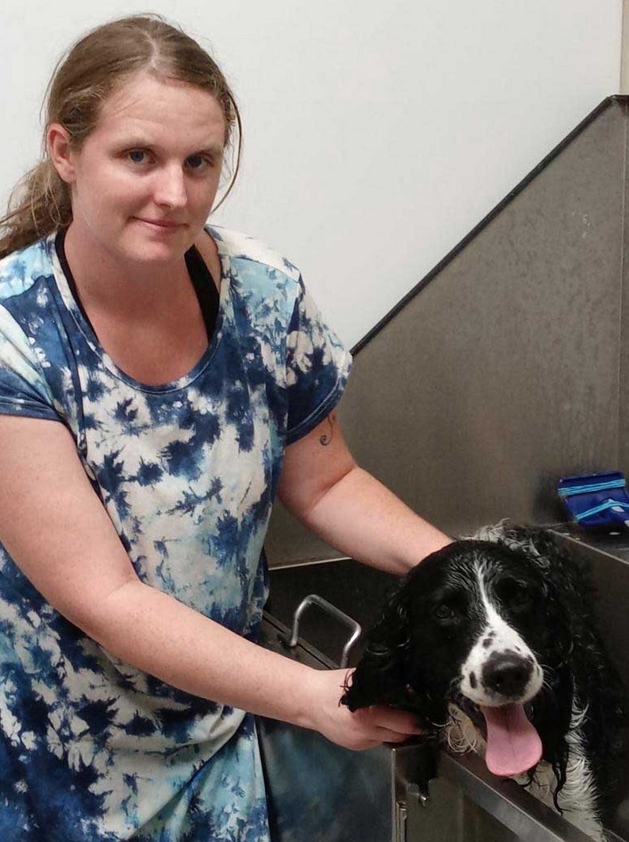 Kaylee Mae LaVae with a dog in the tub