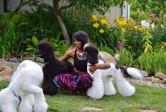 Deja Pearson and 3 poodles