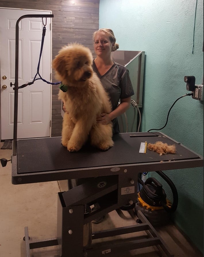 Tara Kunsman with a client after a bath and brush