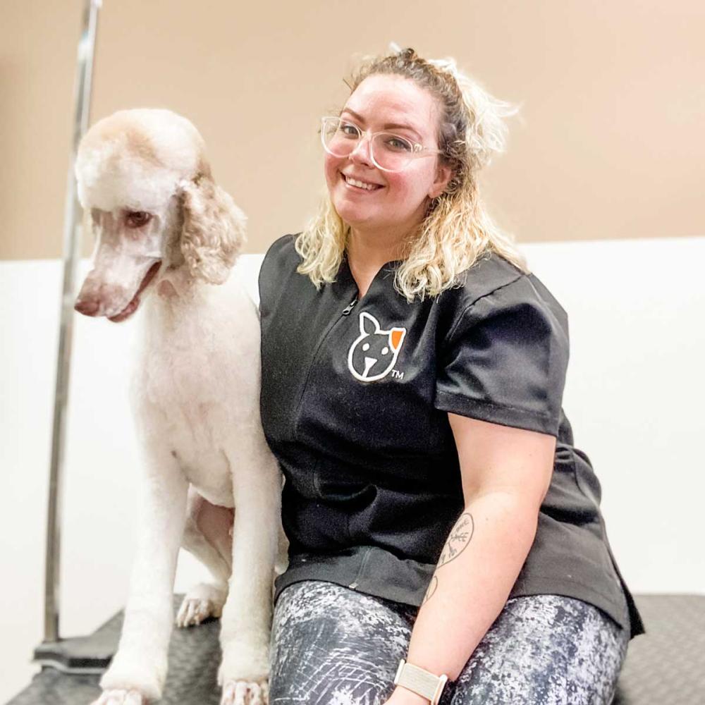 Taylor the Vet Groomer with a client